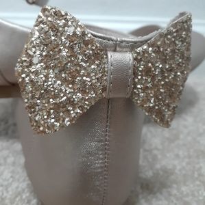 Girls gold dress shoe.